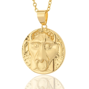 Macro detail of vintage 18K gold plated Taurus zodiac relief pendant necklace