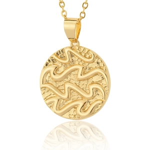 Macro view of 18K gold plated Aquarius zodiac coin pendant with embossed wave patterns