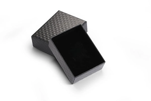 Detail of elegant black jewelry gift box with rhombus texture and velvet lining