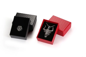 Gothic silver bull head necklace and mask ring displayed in red and black jewelry gift boxes