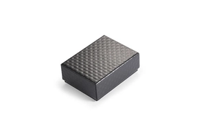 Close-up of a minimalist black jewelry gift box featuring a quilted diamond pattern