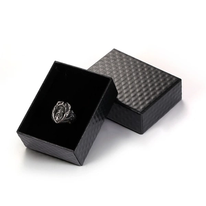 Vintage silver warrior ring displayed in a black textured jewelry gift box on white background