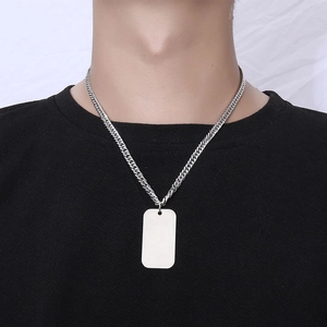 Men's titanium steel military dog tag necklace with a brushed finish on a black t-shirt