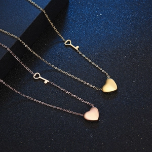 Titanium steel heart lock and key pendant necklaces in gold and rose gold finishes