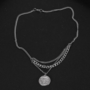 Men's layered silver titanium steel necklace with punk coin pendant on black surface