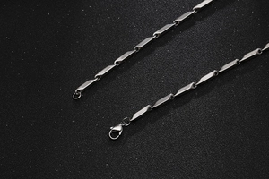 Detail of silver bamboo-style hip hop chain necklace with lobster clasp for men