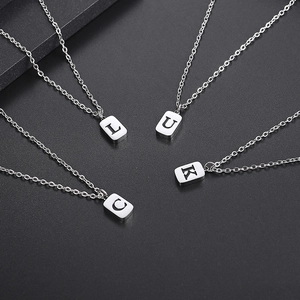 Minimalist silver titanium steel necklaces featuring L U C K square letter pendants
