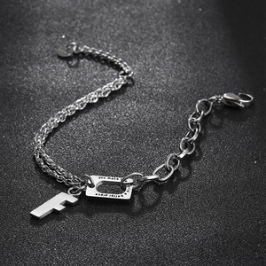 Industrial style titanium steel bracelet with letter F charm and engraved quote plate