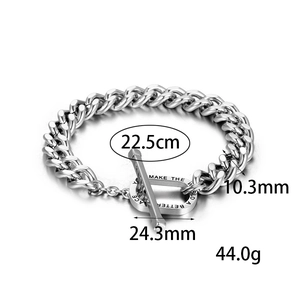 Close-up of stainless steel chain bracelet with OT toggle clasp and engraved lettering