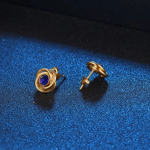 Golden spiral circle earrings with deep blue sapphire zircon in a vintage luxury style