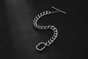 Detail of silver T-bar toggle clasp bracelet with engraved inspirational message