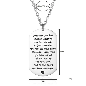 Detail of dog tag necklace showing 60cm chain length and 45mm x 27mm pendant dimensions