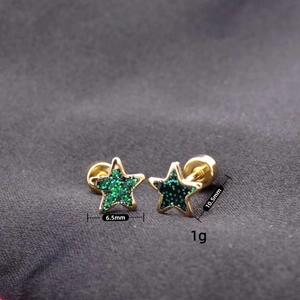 Macro shot of star earrings showing 6.5mm width and 10.5mm length dimensions