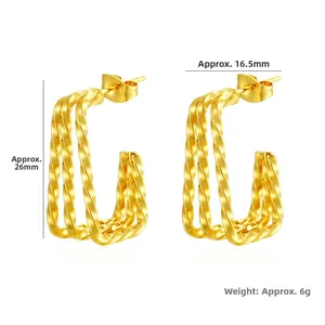Detail of gold geometric earrings showing 26mm height and 16.5mm width dimensions