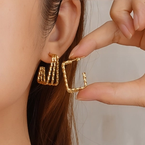 Golden multi-layer twisted geometric earrings with minimalist rectangular design