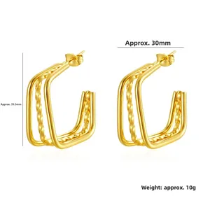 Detailed view of gold plated triple layer geometric hoop earrings with twisted texture