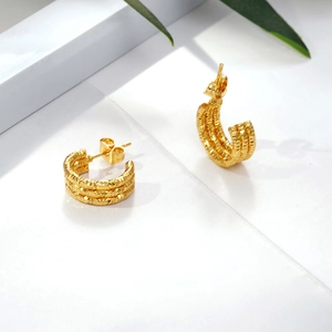 Multi-layer gold stainless steel hoop earrings with textured diamond-cut surface pattern