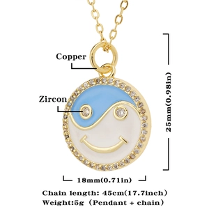 Detail showing copper smile yin yang pendant with blue white enamel and zircons