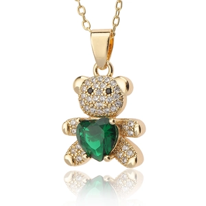 Golden bear necklace featuring a large green heart zircon and white pavé-set stones
