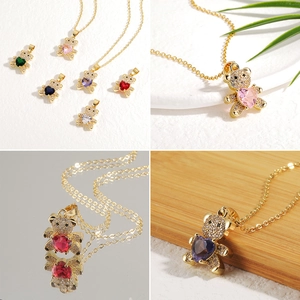 Women's copper necklace featuring a micro-pave bear pendant with a heart-shaped gemstone