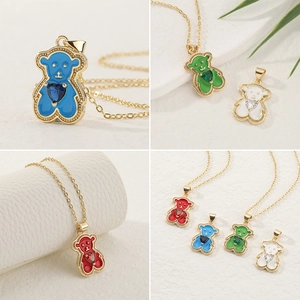 Cute gold bear pendant necklaces with heart gemstones and colorful enamel finish