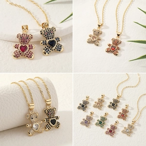 Detail of colorful teddy bear pendants with sparkling micro-pave zircons and heart stones