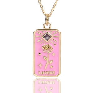 Rectangular gold tarot pendant necklace with pink enamel rose and purple gemstone detail