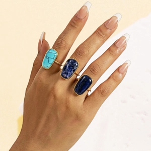 Anillos vintage de acero con piedras naturales ovaladas y bordes de perlas doradas