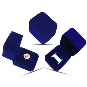 Blue velvet ring box with LED light showing open and closed states on white background