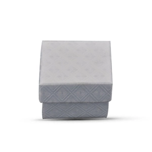 Macro shot of light gray jewelry box featuring premium embossed diamond textures