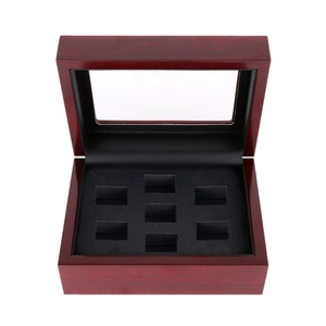 Top view of 6-slot wooden jewelry box with glass window and black ring cushions