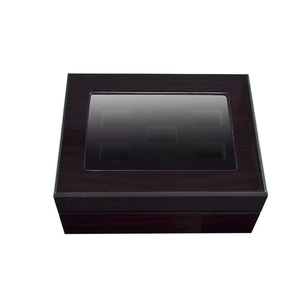 Detail of dark brown wood jewelry box with multiple slots and clear glass window lid