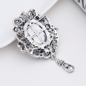 Vintage silver crystal brooch featuring a lady portrait cameo and teardrop pendant