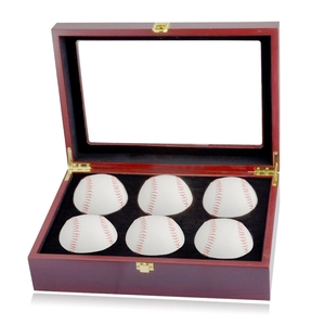 Macro detail of wooden 6-slot baseball display case with glass lid and gold metal lock