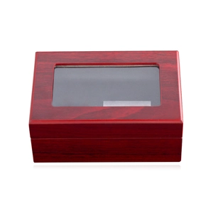 Detail view of a luxury rosewood grain jewelry box featuring a clear top display window