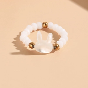 Cute white beaded rabbit ring for women featuring gold beads and shell texture