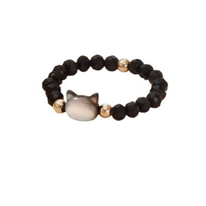 Elastic beaded cat ring with black faceted beads and shimmering mother of pearl cat charm