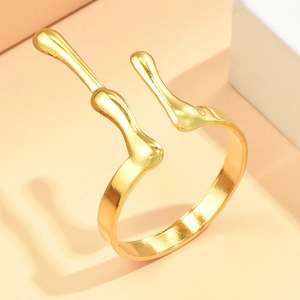 Adjustable golden stainless steel antler ring with lava drip texture in minimalist style