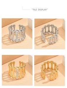 Detail view of gold and silver vintage geometric rings with rhinestones and adjustable bands