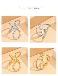Detailweergave van minimalistische golfvormige ringen in goud en zilver mat