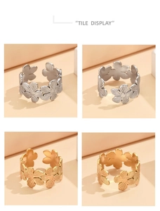 Details von gold- und silbernen Blumenringen mit texturierten Blüten und offenem Design