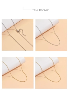 Dettaglio di catene in acciaio inossidabile oro 18K e argento con chiusura a moschettone e extender