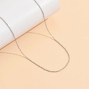 Sparkling silver-toned stainless steel star-dotted chain necklace with reflective finish