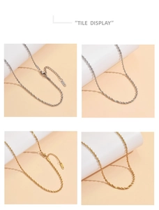 Dettaglio di collane a corda in oro e argento con chiusura a moschettone e tag S.STEEL