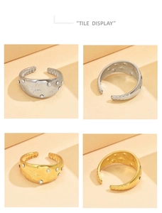 Detailed tile display of gold and silver star engraved rings with adjustable opening