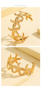 Detailed close-up showing the textured golden starfish pattern on an adjustable bangle