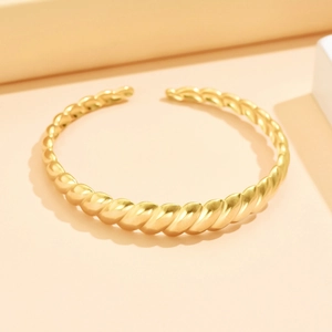 Minimalist twisted croissant open cuff bracelet in 18K gold plated stainless steel