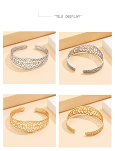 Close-up of gold and silver open bracelets featuring intricate hollow floral patterns