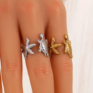 Marine series stainless steel rings with silver and gold starfish and turtle designs