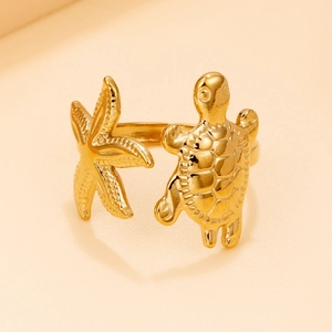 Gold stainless steel open ring featuring detailed sea turtle and starfish ocean motifs